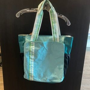 Boca tennis and golf suede accented large tote bag.